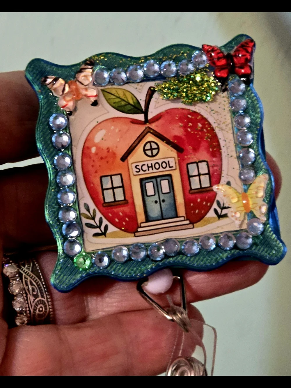 Handcrafted School Apple Badge Reel — Teal, Red, Yellow Accents